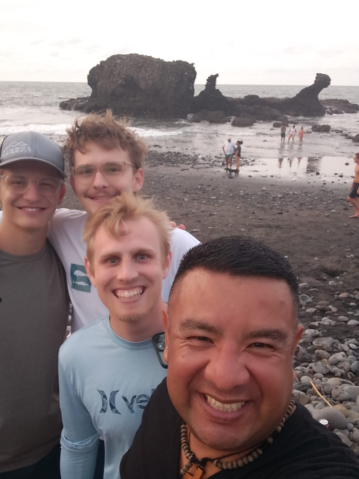 Group of friends taking a sunset selfie at El Tunco beach