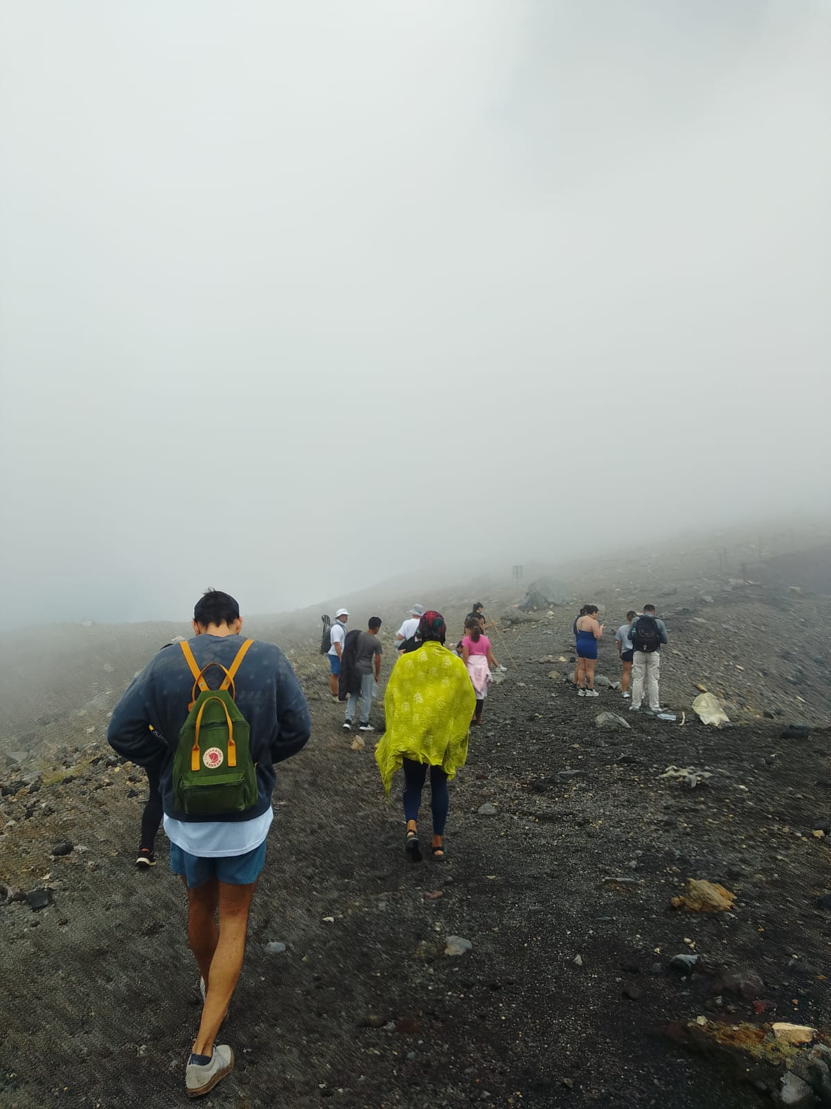 Guests climbing the Santa Ana volcano through morning fog