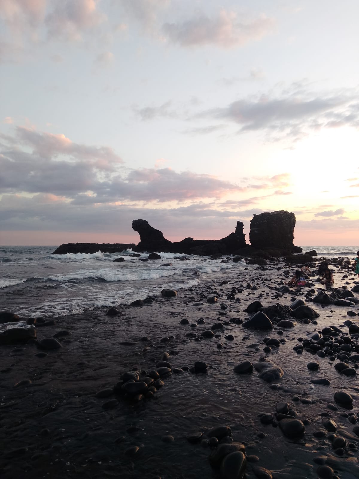 El Tunco's iconic rock arch at sunset on the Pacific coast
