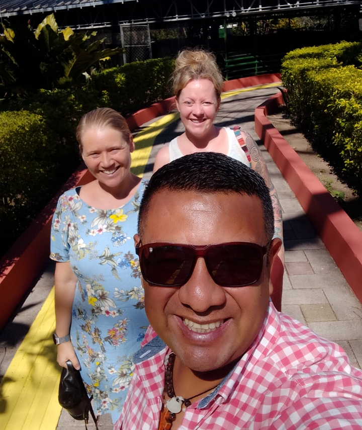 VIP Tours El Salvador guide walking outdoors with two guests