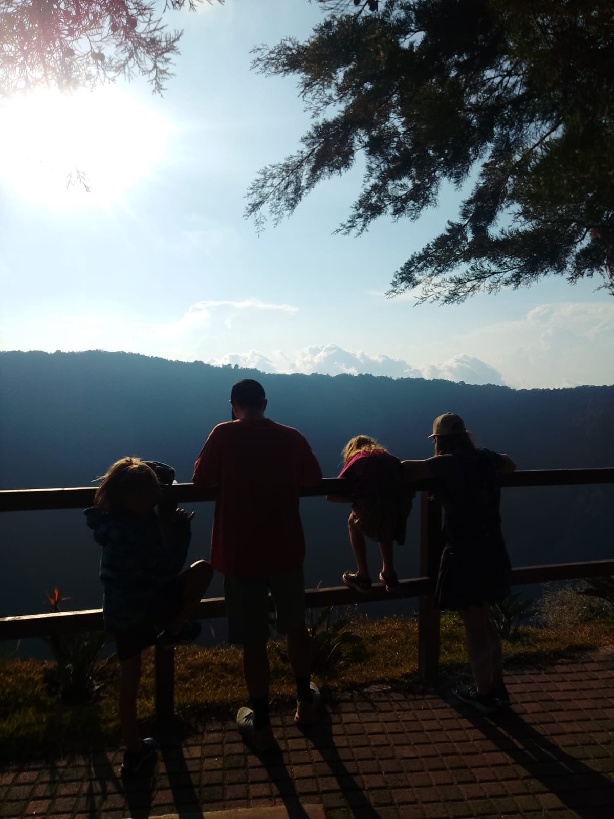 Family taking in a Salvadoran sunset viewpoint together