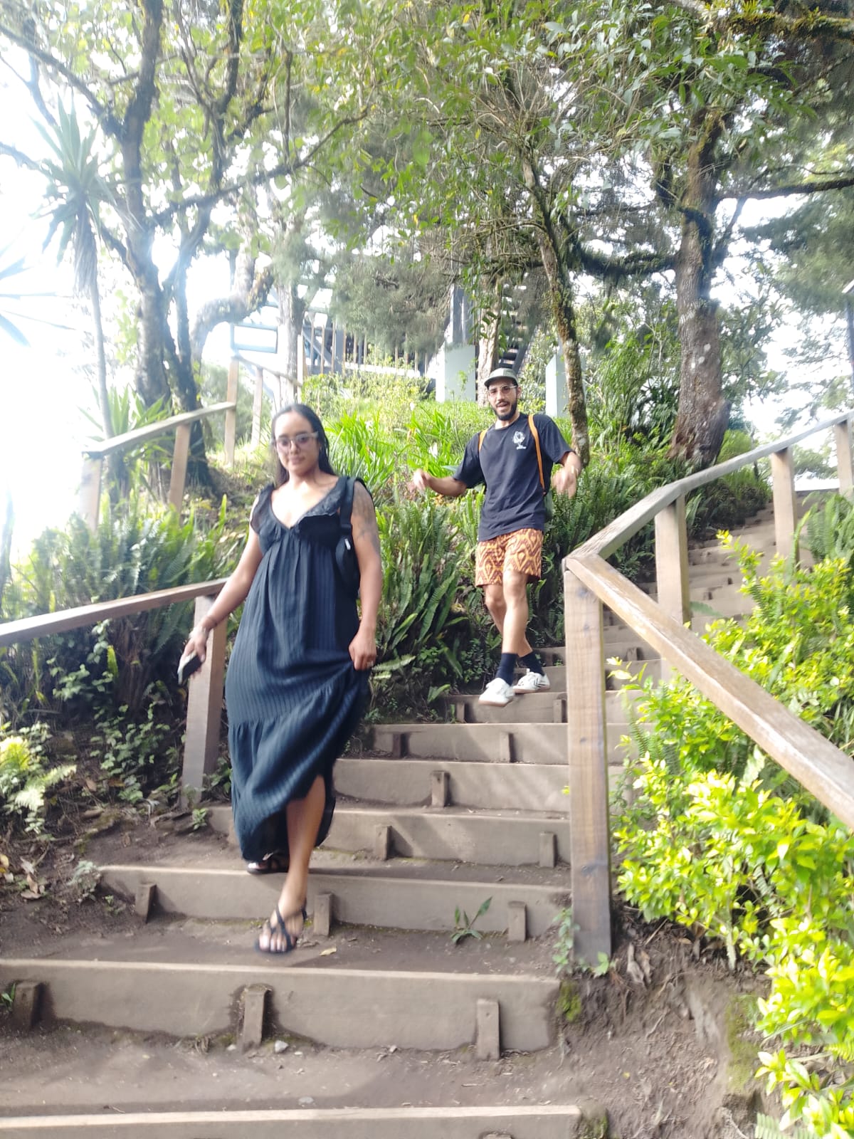 Couple walking down forest stairs in Cerro Verde National Park
